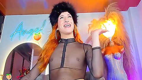 A sexy lingerie is presented on the red head that wears a sexy top