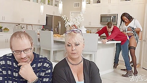 Brunette ebony babe is giving a facial to a big cock