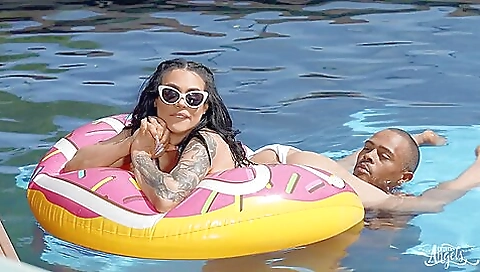 Tattooed girl in shorts and a t-shirt shows her natural talent