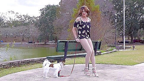 Sexy brunette outdoor solo video with a black skirt